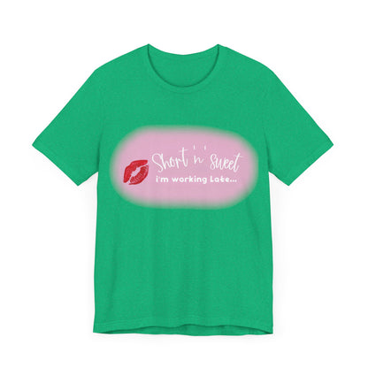 Sabrina Carpenter Inspired Unisex Short Sleeve Tee with vibrant lipstick print, front view highlighting playful text design in bold colours.