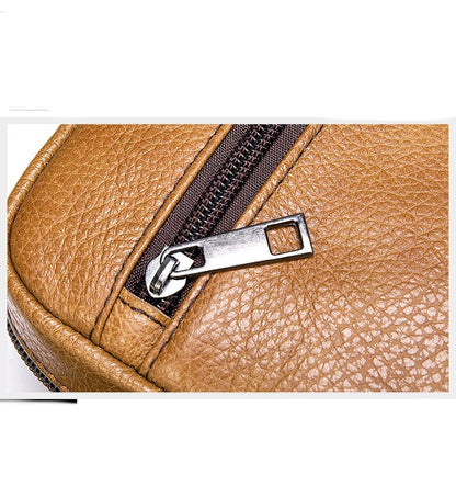 Close-up view of the zipper on the Dazzling Men's Genuine Leather Small Shoulder Bag, highlighting its premium craftsmanship and attention to detail in the elegant litchi pattern.