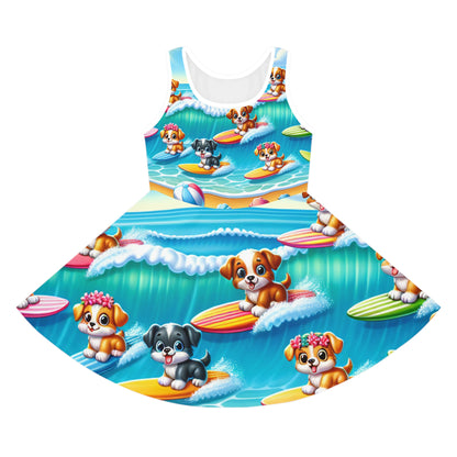 Lulu Bellefonte Girls Sundress showcasing a vibrant surfing pups design, perfect for summer fun, featuring playful cartoon dogs riding surfboards against a bright blue ocean backdrop.