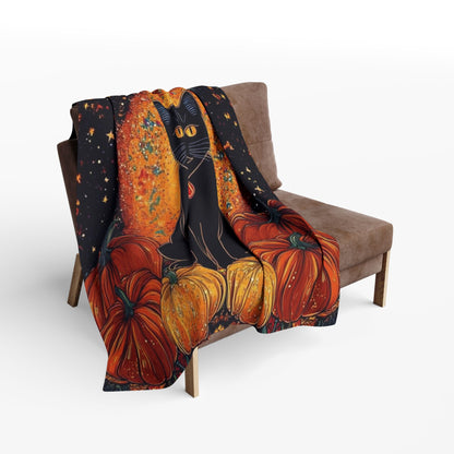 Decorative and Warm Halloween Spooky Arctic Fleece Blanket draped over a chic couch, featuring a black cat among vibrant pumpkins, perfect for enhancing your Halloween decor.