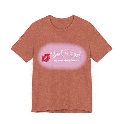 Sabrina Carpenter Inspired Unisex Short Sleeve Tee with Vibrant Lipstick Print, featuring a playful message and stylish design.