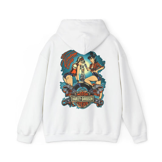 Elegant vintage garage hoodie featuring a stunning back print with retro pin-up women working on a motorcycle, set against a vibrant teal-blue background, embodying nostalgia and style.