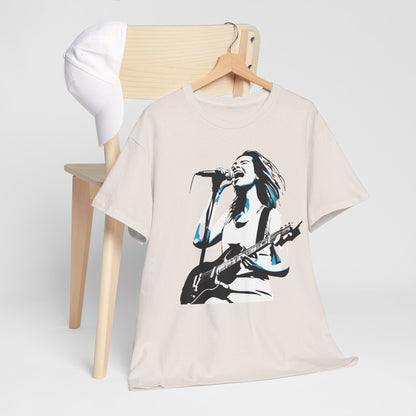 Legend of Rock Graphic T-Shirt draped over a wooden chair with a cap, highlighting its chic urban aesthetic and rock-inspired graphic design.