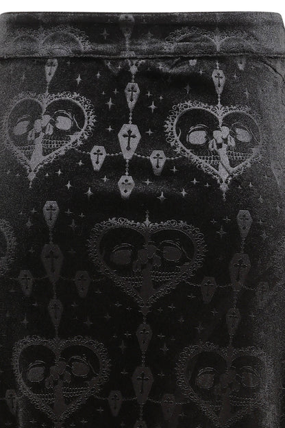 Stylish model wearing the Banned Trivia gothic skirt, paired with a fitted velvet top, embodying a dramatic and refined gothic aesthetic.