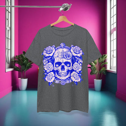 Skulls and Roses Cotton Tee displayed in a stylish interior setting, highlighting its unique graphic design against a vibrant pink background for an edgy fashion statement.