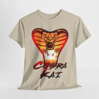 Luxurious Cobra Kai graphic T-shirt featuring a striking cobra design against a sunset backdrop, perfect for martial arts enthusiasts and fans of the iconic series. This unisex cotton tee offers a blend of style and humour, ideal for casual outings or gifting.