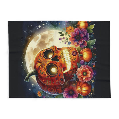Decorative and Warm Halloween Spooky Arctic Fleece Blanket featuring a vibrant pumpkin skull design surrounded by colourful flowers and a full moon, perfect for adding a luxurious seasonal touch.