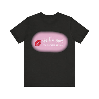 Sabrina Carpenter Inspired Unisex Short Sleeve Tee featuring a vivid lipstick print on a classic black background, embodying style and individuality.