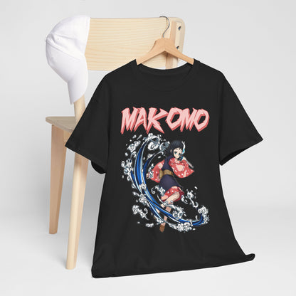 Makomo anime T-shirt displayed with a stylish cap on a minimalist wooden chair, showcasing a vibrant design perfect for fashion-forward aficionados.