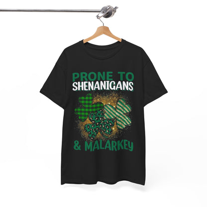 Elegant St. Patrick's Day t-shirt stacked neatly, showcasing the playful shamrock graphic and the text 'Prone to Shenanigans & Malarkey'. Perfect for those who embrace festive spirit.