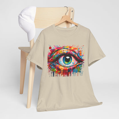 Chic beige t-shirt draped over a wooden chair accompanied by a stylish white cap, featuring a captivating 'Visionary Drip' design of a colourful eye, ideal for creative expression.