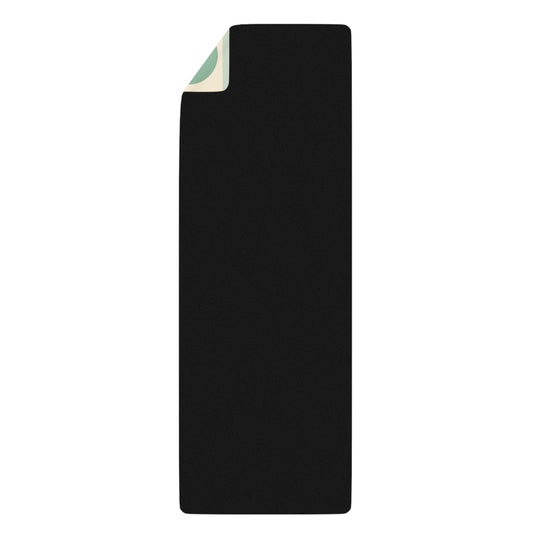 Daria Bellucci Designer Yoga Mat rolled up with a sleek black surface, perfect for stylish storage and convenient transport, combining both elegance and functionality.