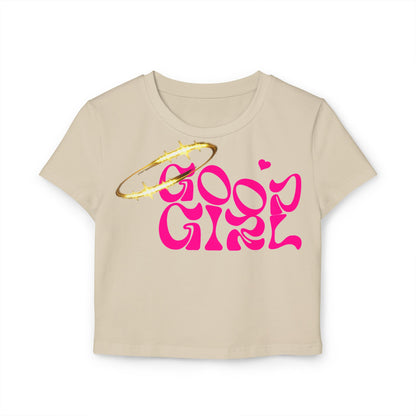 Elegant beige cropped tee featuring 'Good Girl' graphic in bold pink font, adorned with a gold halo design, perfect for a chic casual look.