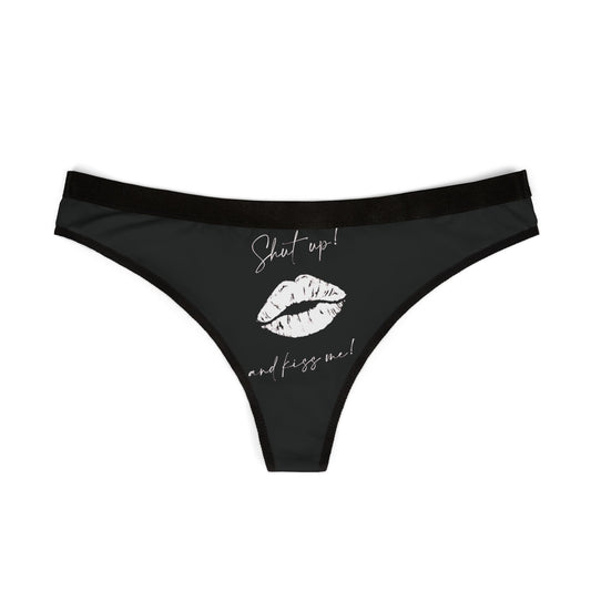 Elegant women's black thong featuring a playful graphic text "Shut up!" and a bold lip print in white, perfect for romantic occasions.