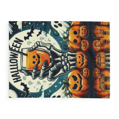 Decorative and Warm Halloween Spooky Arctic Fleece Blanket showcasing a skeleton hand holding a spooky beverage, surrounded by festive pumpkins and a hauntingly beautiful moonlit scene.