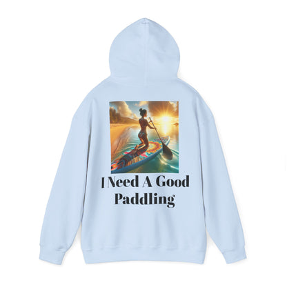 Fantasy Paddleboarding Unisex Hooded Sweatshirt featuring a vibrant ocean sunset design and the phrase I Need A Good Paddling, perfect for paddleboarding enthusiasts seeking comfort and style.