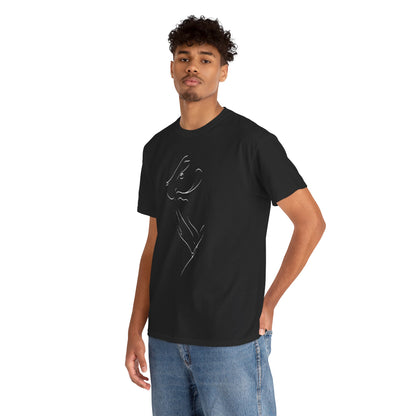 Stylish young man wearing a black graphic t-shirt adorned with a captivating animal design, exuding luxury and charm in casual wear.