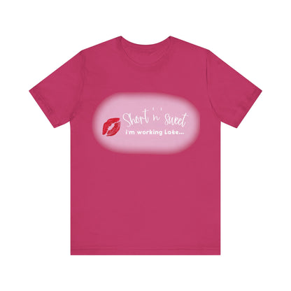 Sabrina Carpenter Inspired Unisex Short Sleeve Tee in a rich pink shade adorned with a vibrant lipstick print, perfect for adding flair to any wardrobe.