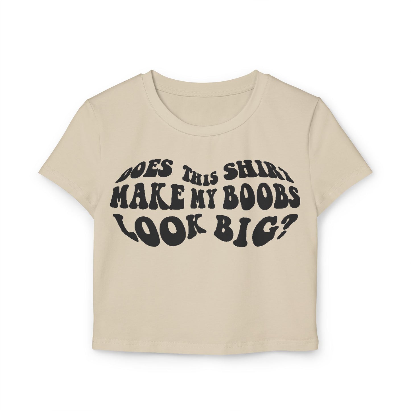 Sophisticated beige women's t-shirt displaying the cheeky text 'Does This Shirt Make My Boobs Look Big?' in a retro font, a perfect blend of comfort and playful style.