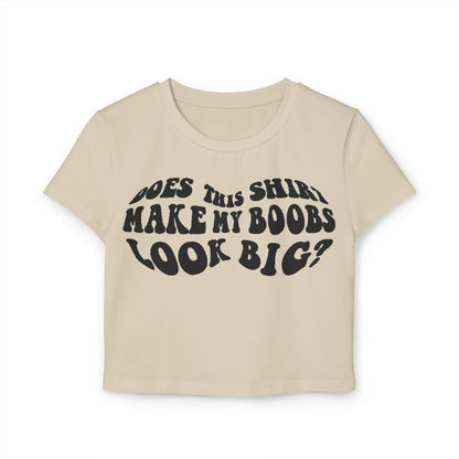 Sophisticated beige women's t-shirt displaying the cheeky text 'Does This Shirt Make My Boobs Look Big?' in a retro font, a perfect blend of comfort and playful style.