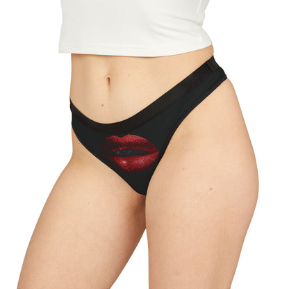 Fashionable women's thong modelled on a figure, adorned with a bold graphic of red lips, exuding playful elegance for romantic occasions.