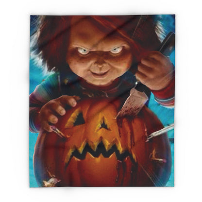 Decorative and Warm Halloween Chucky Spooky Arctic Fleece Blanket featuring a chilling scene with Chucky carving a jack-o'-lantern, perfect for adding an eerie touch to your Halloween decor.