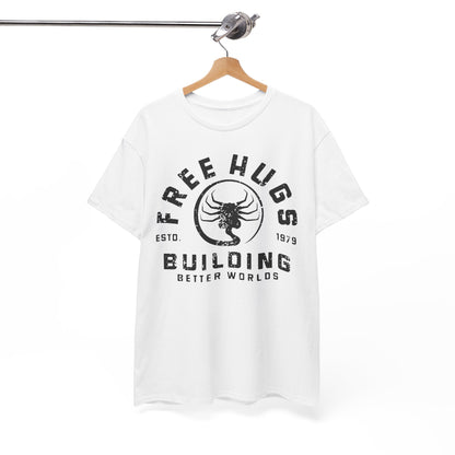 Elegant white t-shirt displayed on a hanger, highlighting the bold 'FREE HUGS' and 'BUILDING BETTER WORLDS' prints in a chic font, perfect for any street style.