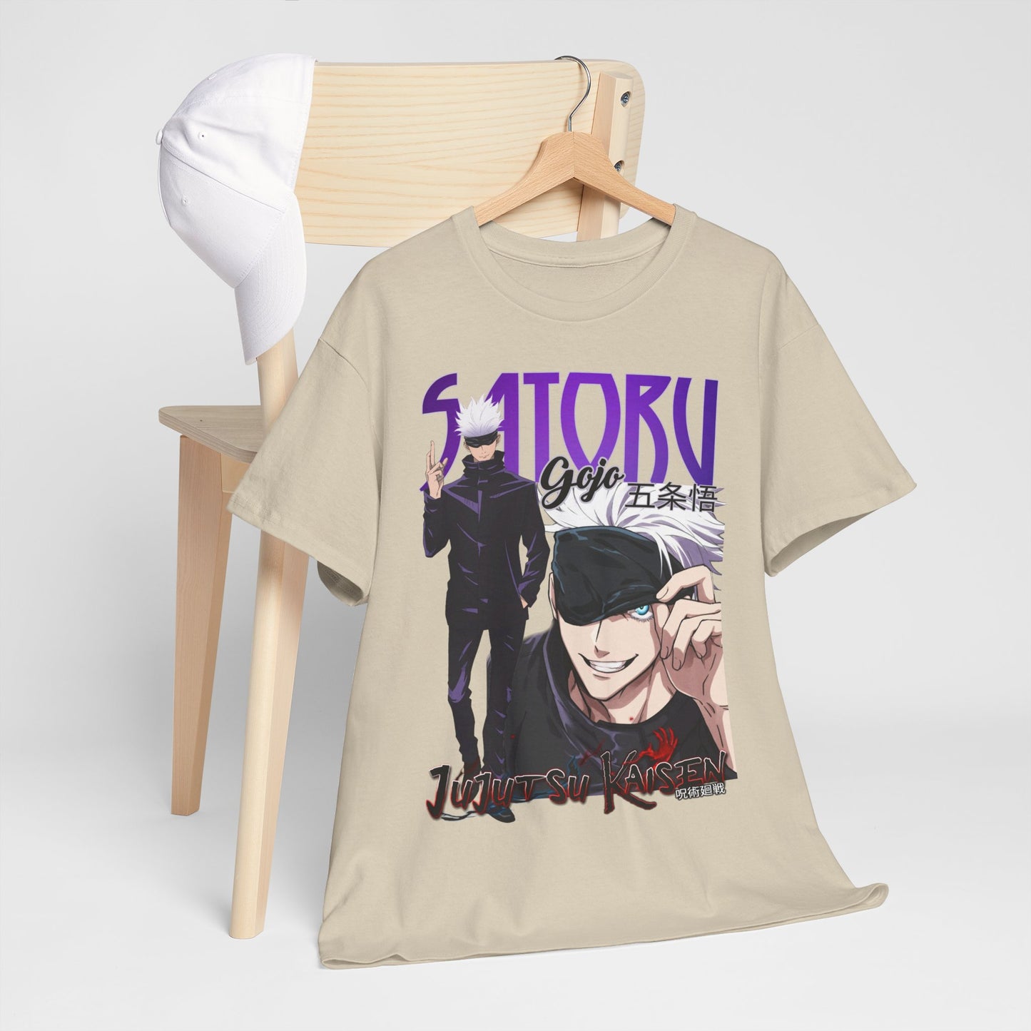 Chic Jujutsu Kaisen t-shirt featuring Gojo Satoru, showcased elegantly on a chair with a cap, symbolising a refined blend of anime culture and fashion.