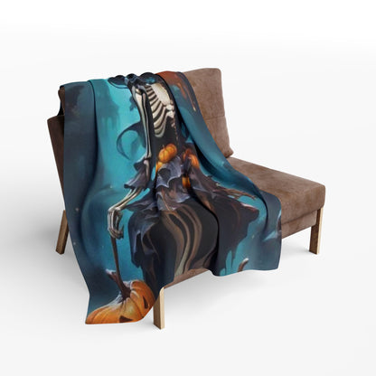 Chic sofa adorned with the Decorative and Warm Halloween Spooky Arctic Fleece Blanket, featuring a whimsical skeleton design perfect for seasonal decor.