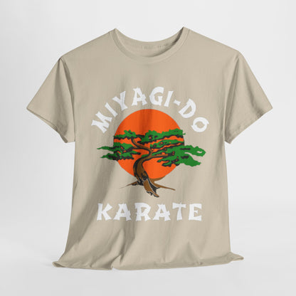 Elegant unisex Miyagi-Do Karate graphic t-shirt in a soft beige fabric, featuring a vibrant orange sun and intricately designed tree motif, epitomising a blend of style and martial arts heritage.