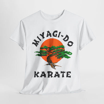 Elegant unisex graphic t-shirt featuring the Miyagi-Do Karate logo against a vibrant orange sun, showcasing a stylized bonsai tree with intricate detailing. Perfect for martial arts enthusiasts, this premium cotton tee embodies a blend of style and philosophy.