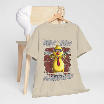 Stylishly draped t-shirt with a whimsical gangster chicken illustration, paired with a crisp white cap on a wooden chair, perfect for a sophisticated yet playful fashion statement.