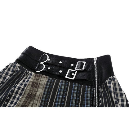 Detail image of the Dark In Love Skirt's intricate plaid patchwork, highlighting the blend of grunge and punk elements in this contemporary alternative fashion piece.