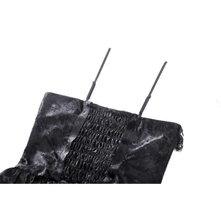 Close-up of the Harriet Punk dress fabric showcasing shiny PU leather texture with intricate ruffles and strap details.