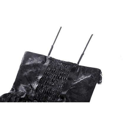 Close-up of the Harriet Punk dress fabric showcasing shiny PU leather texture with intricate ruffles and strap details.