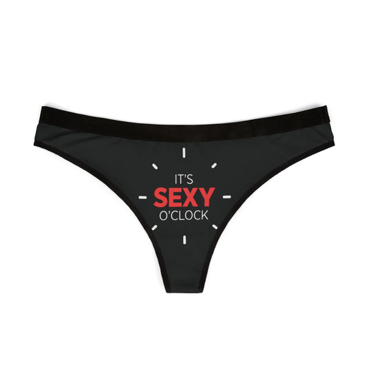 Luxurious women's thong featuring a bold print that reads 'IT'S SEXY O'CLOCK', designed for playful intimacy and romantic moments, ideal for Valentine's Day and special occasions.