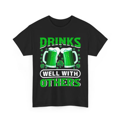 Front view of a luxury Funny St. Patrick's Day Unisex T-Shirt with 'Drinks Well With Others' in bold green text, showcasing an eye-catching Irish beer mug design.