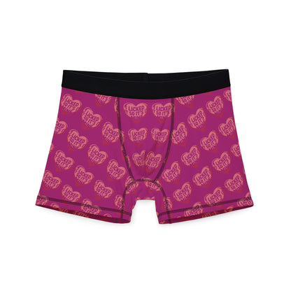 Valentines Naughty Cheeky Mens Boxer Briefs featuring a bold pink design with playful heart graphics and the phrase 'I LICKED IT SO IT'S MINE', perfect for a humorous romantic gift.