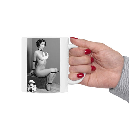 Funny Princess Leia Mug - A luxurious ceramic mug featuring a bold, artistic design inspired by Princess Leia, showcasing her iconic hairstyle and Rebel Alliance symbol, held gracefully in a hand. Perfect for fans of Star Wars, this drinkware piece adds a humorous twist to your beverage experience.