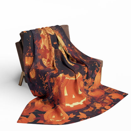 Sophisticated Decorative and Warm Halloween Spooky Arctic Fleece Blanket artfully draped over a chair, featuring vivid Halloween motifs including pumpkins and decorative elements, perfect for festive gatherings.