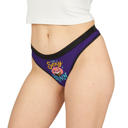 A luxurious women's graphic thong featuring playful text that reads 'I have a sexy brain,' designed for romantic occasions. The thong is in a vibrant purple shade with sleek black trim, exuding charm and cheekiness, perfect for adding a fun twist to intimate apparel.