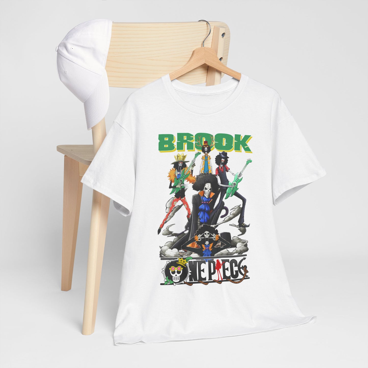 Elevate your style with the Brook graphic t-shirt featuring vibrant anime characters, showcased on a minimalist background with a wooden chair, embodying casual chic elegance.