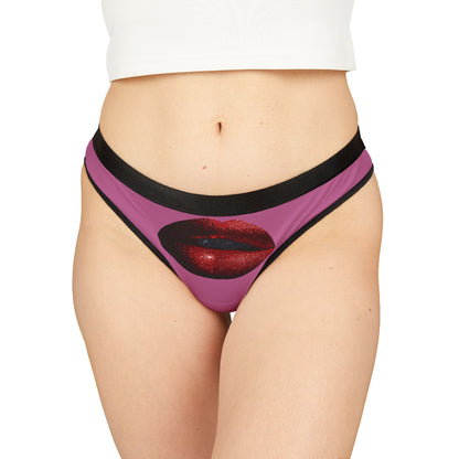 Luxurious women's graphic thong featuring a bold illustration of glittering red lips on a vibrant pink background, designed for cheeky flair and playful romance. Perfect for gifting on special occasions like Valentine's Day or anniversaries.