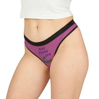 Luxurious vegan thong panties featuring a playful design with the text 'Eat Pussy, It's Vegan' in bold letters on a vibrant purple fabric, perfect for adding a cheeky touch to your lingerie collection.
