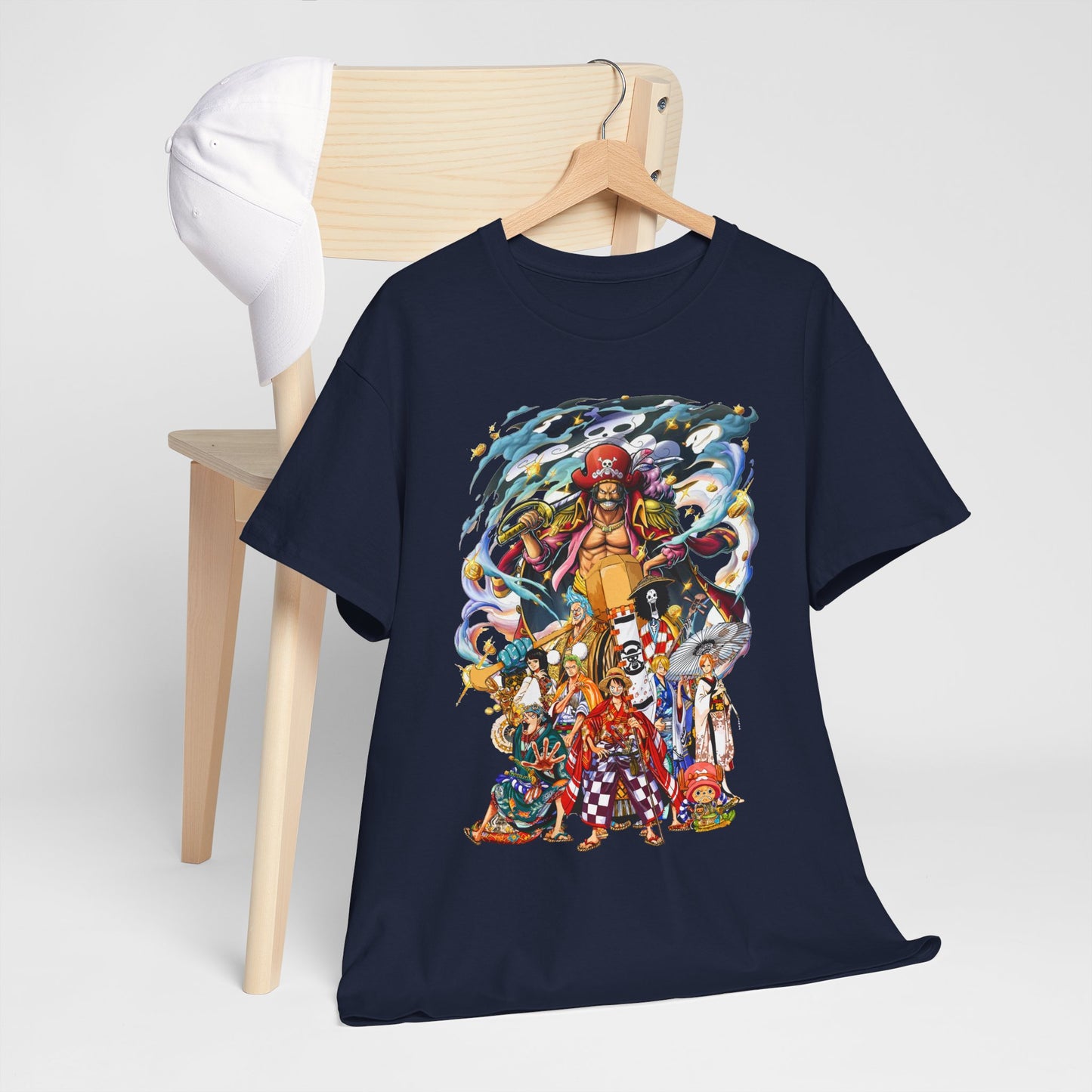 Stylish presentation of the Epic 1 Piece Adventure Men's T-Shirt draped elegantly on a wooden chair beside a chic cap, showcasing its dynamic pirate graphics and versatile fashion appeal.