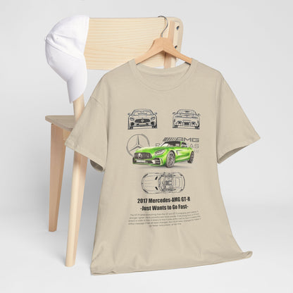 Sophisticated men's t-shirt displayed with a green Mercedes-AMG GT-R graphic, elegantly positioned near a minimalist chair, epitomizing luxury automotive fashion.