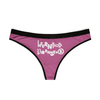 Front view of the sophisticated INTERNATIONAL PORSTAR™ Women's Thong featuring whimsical text on a pink background, designed for the confident woman.
