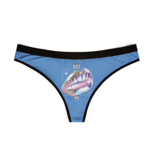 Elegantly designed blue thong displaying a holographic lips motif and 'EAT ME' lettering, ideal for those seeking playful yet alluring lingerie.