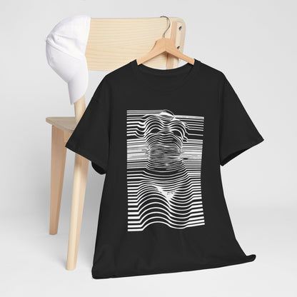 Black cotton t-shirt displayed on a stylish wooden chair alongside a white cap, highlighting an exquisite optical illusion design that emphasizes both humour and sophistication.