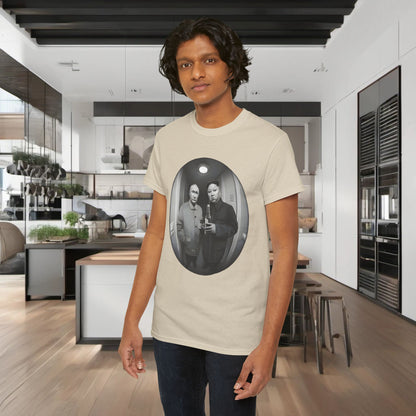 Stylish male model wearing the luxury 'Meet The Neighbours Funny Gift' graphic t-shirt, designed with a whimsical leader illustration, set against a high-end kitchen backdrop.